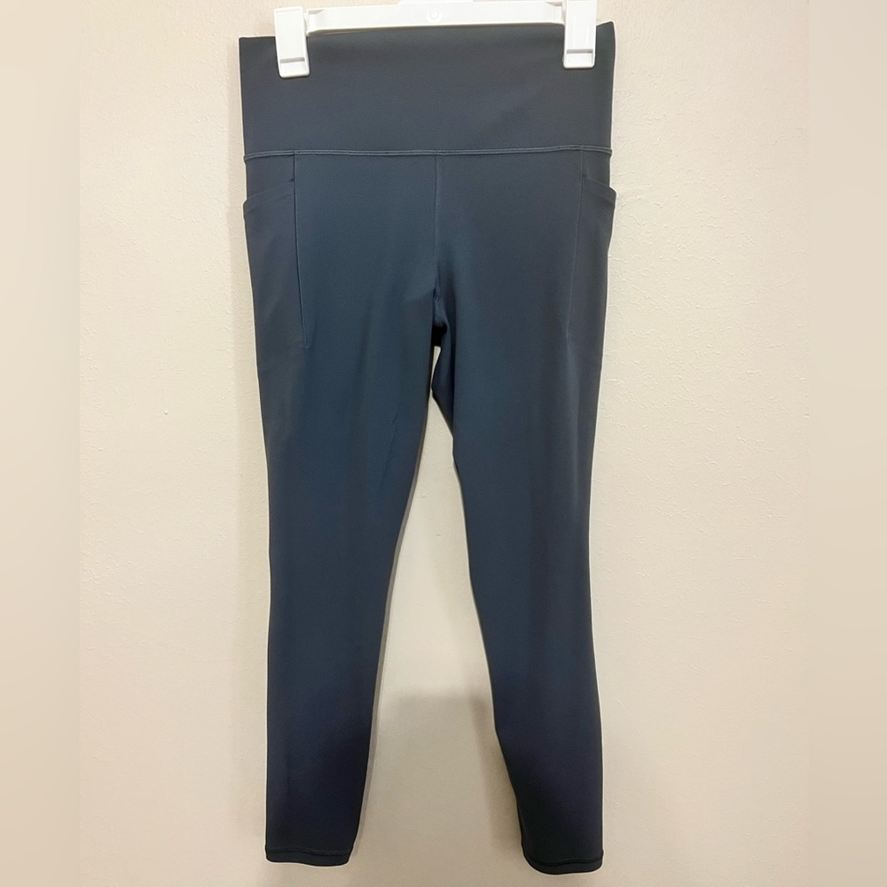 Athleta Salutation Tights with Pockets in Granite Blue. Size M